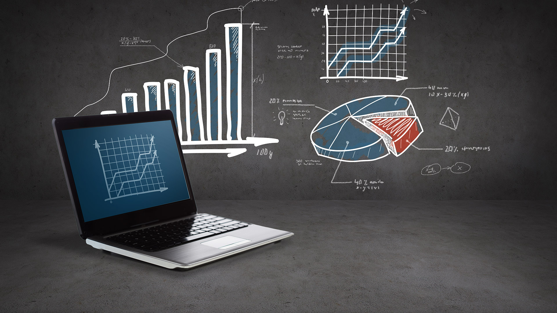  A laptop sits on a desk in front of a chalkboard with graphs and charts representing data analytics for content marketing.